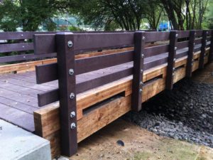 Plastic structural lumber bridge